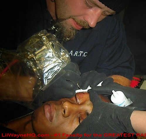 Lil Wayne Fear God Tattoo This is just a picture of Weezy getting his 'Fear 