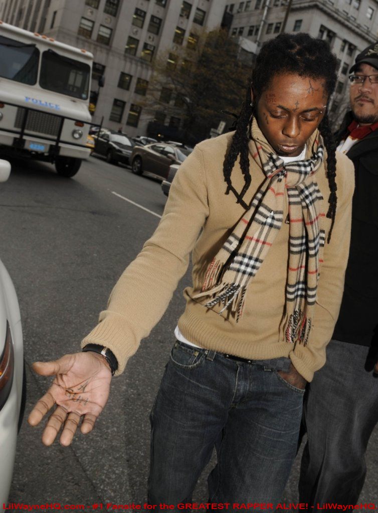 Lil Wayne A Gun Palm Tattoo 'A Gun' tattoo on his palm.