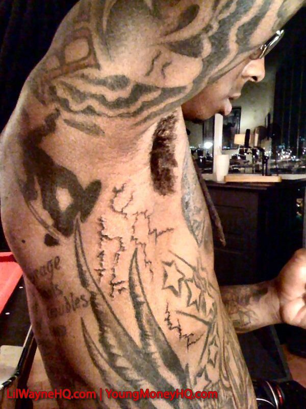 Lil Wayne Wings Tattoo A Gun tattoo on his palm