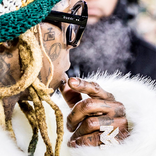 Lil Wayne Tattoos A Dynamite Logo On His Face